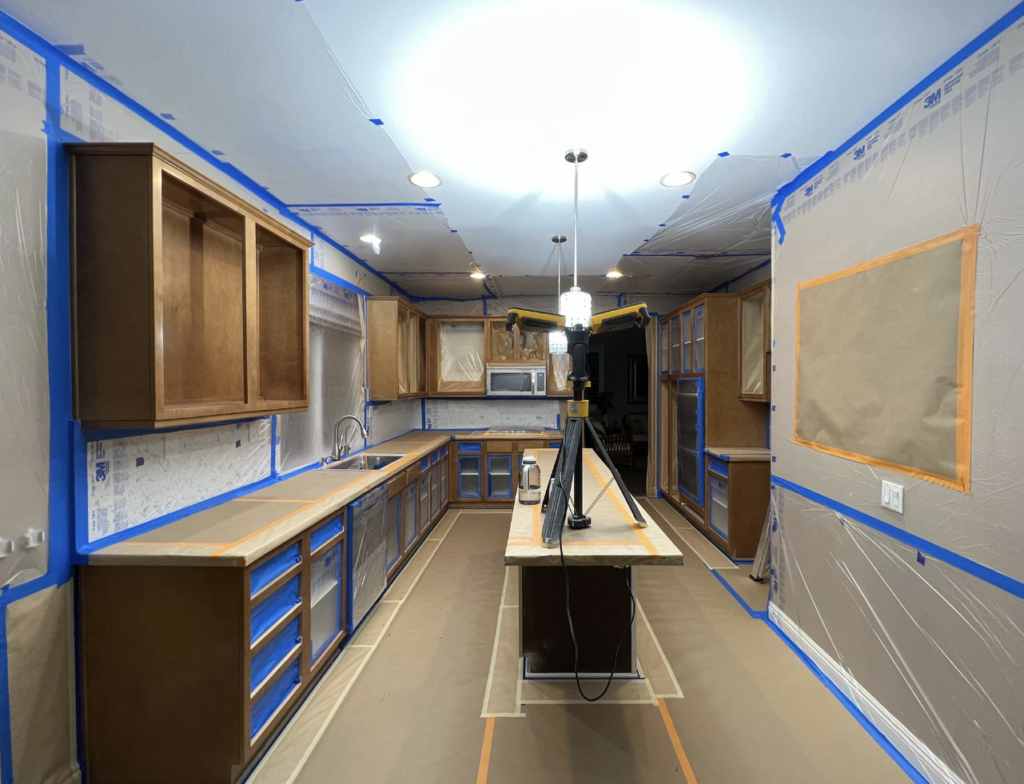kitchen cabinet taped ready for paint